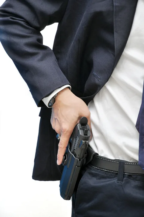 Agent de protection armé, arme de service à la ceinture